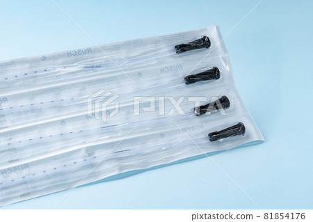 Rusch male and female all purpose catheter on blue background, straight tipped intermittent catheters designed for a single use, packaged individually and sterile 81854176