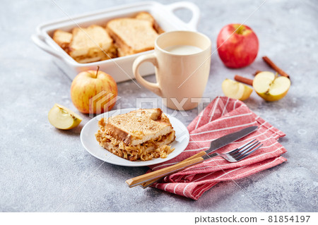 Bread pudding breakfast casserole made from wheat bread, eggs, milk and grated apples Bread pudding breakfast casserole made from wheat bread, eggs, milk and grated apples 81854197