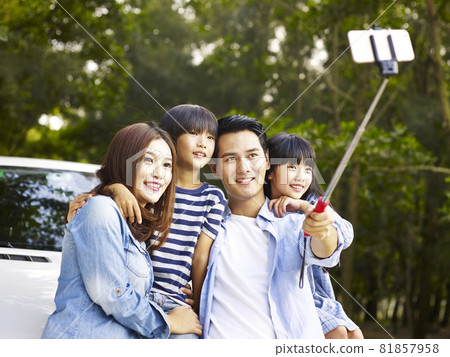 asian family with two children taking a selfie during a trip asian family with two children taking a selfie during a trip 81857958