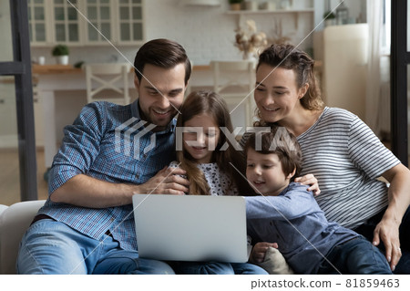 Happy couple of parents and children resting on sofa 81859463