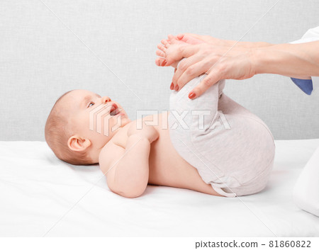 Little baby receiving leg massage in pediatric clinic Little baby receiving leg massage in pediatric clinic 81860822