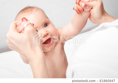 Little baby receiving arm massage in pediatric clinic Little baby receiving arm massage in pediatric clinic 81860847