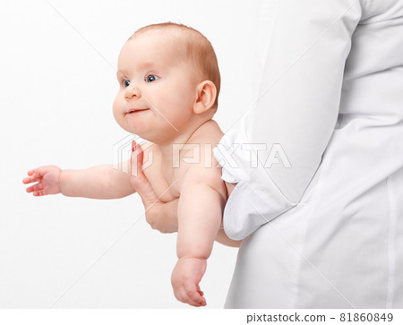 Doctor holding little baby in pediatric clinic Doctor holding little baby in pediatric clinic 81860849