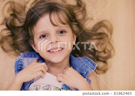 cute little blond baby girl with long curly hair smile laughing 81862465