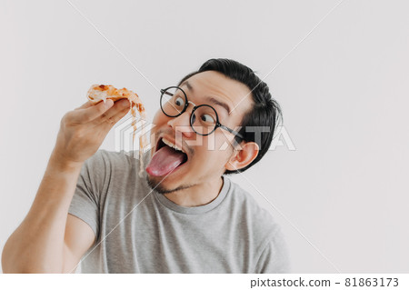 Funny face nerd man has cheesy pizza isolated on white background. 81863173