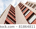 A low angle shot of a residential building 81864811