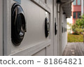 A closeup shot in color of some garbage bins 81864821