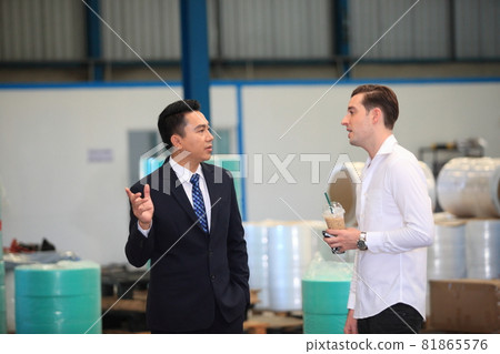 Happy business people talking on meeting at factory industry or Mature company manager greeting a worker in industrial facility or warehouse Happy business people talking on meeting at factory industry or Mature company manager greeting a worker in industrial facility or warehouse 81865576
