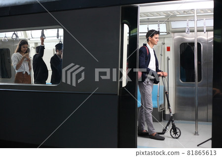 Passenger with casual suit in the Skytrain rails or subway for travel in the big city, lifestyle and transportation concept Passenger with casual suit in the Skytrain rails or subway for travel in the big city, lifestyle and transportation concept 81865613