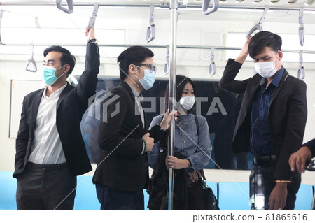 people with mask travel Public electric train, Businessman or woman wearing white facial mask during travel by Public electric train, new normal life style during covid-19 pandemic people with mask travel Public electric train, Businessman or woman wearing white facial mask during travel by Public electric train, new normal life style during covid-19 pandemic 81865616