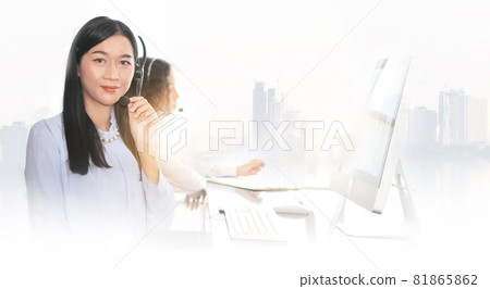 woman agent with headsets working in a call centre,Call center agent with headset working on support hotline in modern office. Call center worker accompanied by her team. 81865862