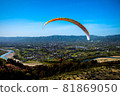 Paraglider taking off on a solo flight 81869050
