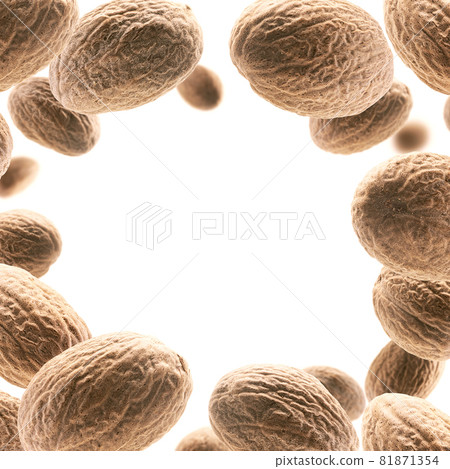 Ripe nutmegs levitate on a white background 81871354