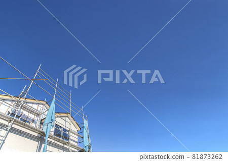 Wooden single-family house under construction against a blue sky with copy space, background, materials Wooden single-family house under construction against a blue sky with copy space, background, materials 81873262