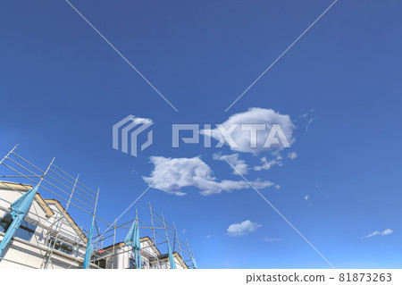 Wooden single-family house under construction against a blue sky with copy space, background, materials Wooden single-family house under construction against a blue sky with copy space, background, materials 81873263