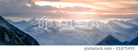 Rocky alpine mountains morning panorama. Cloudy sunrise on summer day. Hohe Tauern National Park, Austrian Alps Rocky alpine mountains morning panorama. Cloudy sunrise on summer day. Hohe Tauern National Park, Austrian Alps 81875455