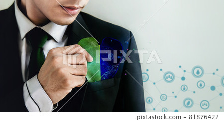 ESG Concept. Nature Meet Technology. Green Energy, Renewable and Sustainable Resources. Ecology Care,Environmental, Social and Corporate Governance. Businessman insert a Leaf in Pocket ESG Concept. Nature Meet Technology. Green Energy, Renewable and Sustainable Resources. Ecology Care,Environmental, Social and Corporate Governance. Businessman insert a Leaf in Pocket 81876422