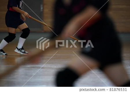 Volleyball player mopping the main floor of the gymnasium Volleyball player mopping the main floor of the gymnasium 81876531