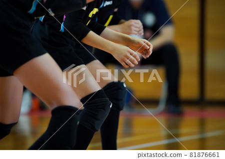 A player preparing to receive after a volleyball serve has been hit A player preparing to receive after a volleyball serve has been hit 81876661