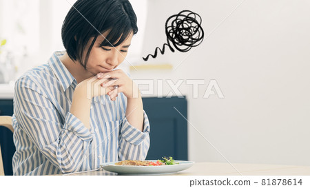 A woman who is in trouble looking at food A woman who is in trouble looking at food 81878614