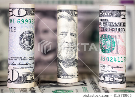Close up to rolled up 50 US dollar . Macro photography of rolled US banknotes. In the background further nomination of US money. The Portrait on the 50 USD is Ulysses Grant, 81878965