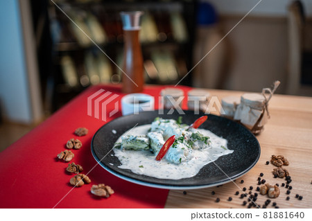 traditional georgian food gebjalia with matsoni cheese and red chili pepper 81881640