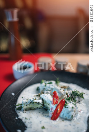 traditional georgian food gebjalia with matsoni cheese and red chili pepper traditional georgian food gebjalia with matsoni cheese and red chili pepper 81881642