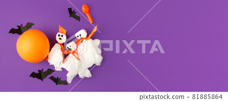 Halloween paper decorations on bright purple violet background. Black bats, ghosts, balloons. Halloween concept. Flat lay, top view, overhead. Party greeting card, invitation, flyer, banner Halloween paper decorations on bright purple violet background. Black bats, ghosts, balloons. Halloween concept. Flat lay, top view, overhead. Party greeting card, invitation, flyer, banner 81885864