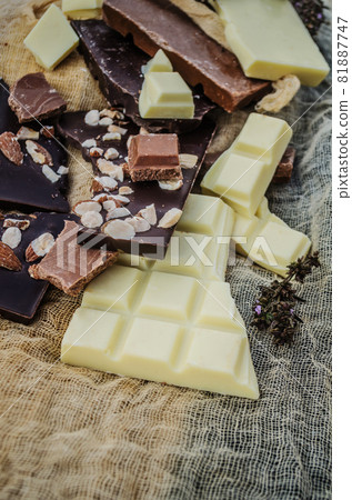 Chocolate mix on rustic wooden background Chocolate mix on rustic wooden background 81887747