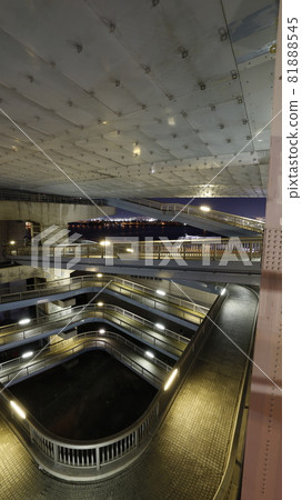 Night view of the sidewalk with a spiral slope provided for pedestrians to rise on the bridge girder of Konohana Ohashi, Konohana-ku, Osaka Night view of the sidewalk with a spiral slope provided for pedestrians to rise on the bridge girder of Konohana Ohashi, Konohana-ku, Osaka 81888545