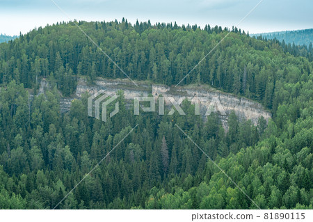 wooded hilly landscape with limestone cliff wooded hilly landscape with limestone cliff 81890115