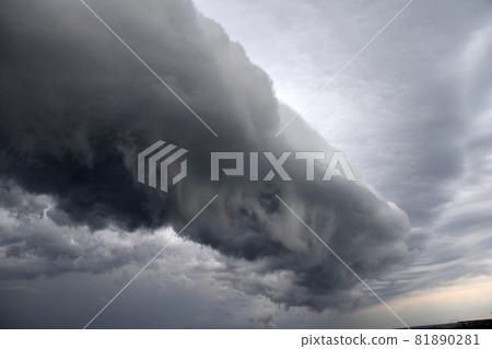 Storm hurricane blue leaden torn clouds on the horizon 81890281