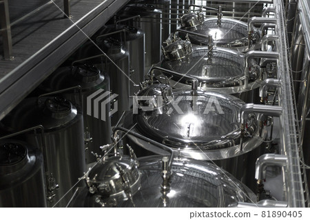 Modern Beer Factory. Steel tanks for beer fermentation and storage. Brewery. Modern beer plant with brewering kettles, Modern Beer Factory. Steel tanks for beer fermentation and storage. Brewery. Modern beer plant with brewering kettles, 81890405