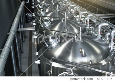 Modern Beer Factory. Steel tanks for beer fermentation and storage. Brewery. Modern beer plant with brewering kettles, Modern Beer Factory. Steel tanks for beer fermentation and storage. Brewery. Modern beer plant with brewering kettles, 81890406