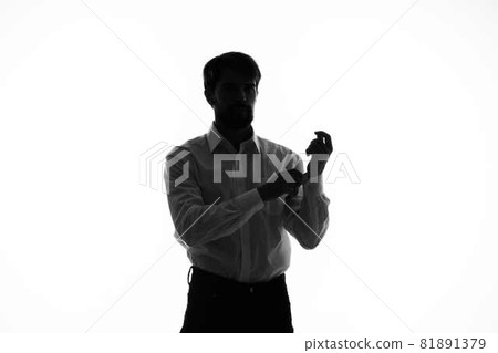 Man Secret agent with a gun in the hands of a crime posing studio Man Secret agent with a gun in the hands of a crime posing studio 81891379