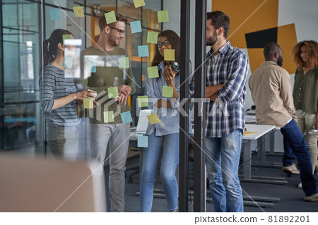 Colleagues discussing speaking about conditions of new project Colleagues discussing speaking about conditions of new project 81892201