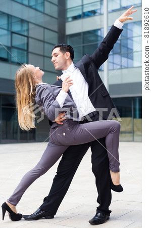 Couple of managers are dancing Couple of managers are dancing 81892610