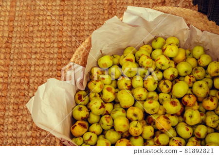 Basket with small green apples close up 81892821