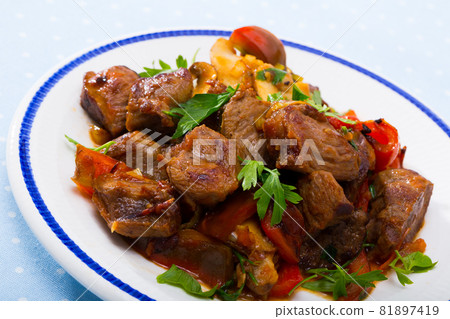 Meat baked with mushrooms and vegetables 81897419
