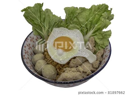 Boil egg noodles with pork ball, minced pork, fried egg and vegetables isolated on white background with clipping path. 81897662