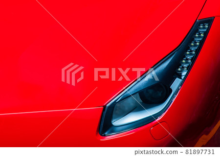 Close-up of Headlights of Red Ferrari car. Close-up of Headlights of Red Ferrari car. 81897731