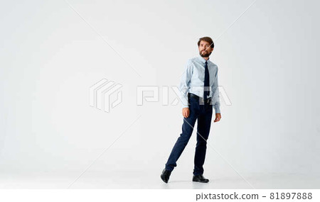business man in shirt with tie manager emotions posing light background 81897888