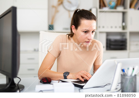 Portrait of a young female business manager in the office Portrait of a young female business manager in the office 81898050