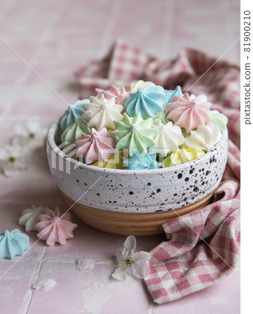 Small colorful meringues in the  ceramic bowl 81900210