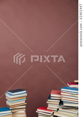 Stacks of books for teaching knowledge university library brown background 81901447