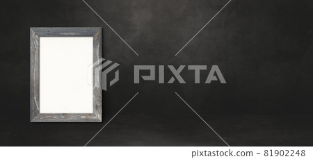 Wooden picture frame leaning on a black wall.... - Stock Illustration ...