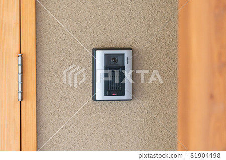 Intercom mounted on the wall of the house Intercom mounted on the wall of the house 81904498