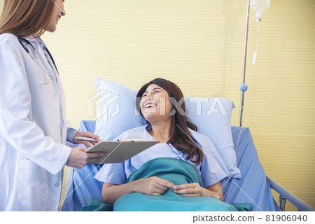 Woman doctor and patient consultation with professional specialist diagnostics at hospital medicare treatment clinic. Doctor talking to patient for medical health care therapy. Healthy medical concept Woman doctor and patient consultation with professional specialist diagnostics at hospital medicare treatment clinic. Doctor talking to patient for medical health care therapy. Healthy medical concept 81906040