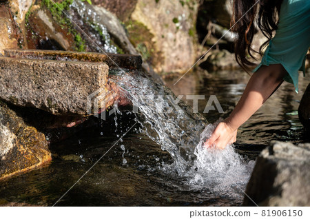 A cold summer river with high transparency flowing through a dam that blends in naturally 81906150