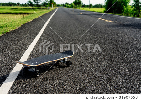 Surf skate on road in the countryside. Surf skate on road in the countryside. 81907558